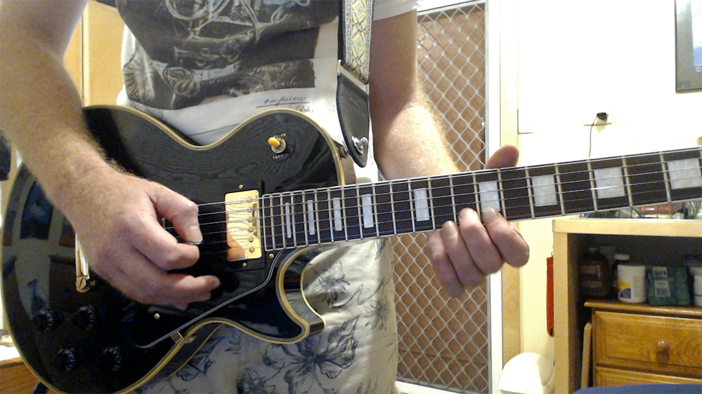 A recent photo with my LQ 'Lacquer Series' Epiphone Les Paul Custom. Although a different brand to my first guitar (an Ibanez), it was made in the same Japanese factory. A recent photo with my LQ 'Lacquer Series' Epiphone Les Paul Custom. Although a different brand to my first guitar (an Ibanez), it was made in the same Japanese factory.